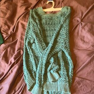 Turquoise knit pullover.